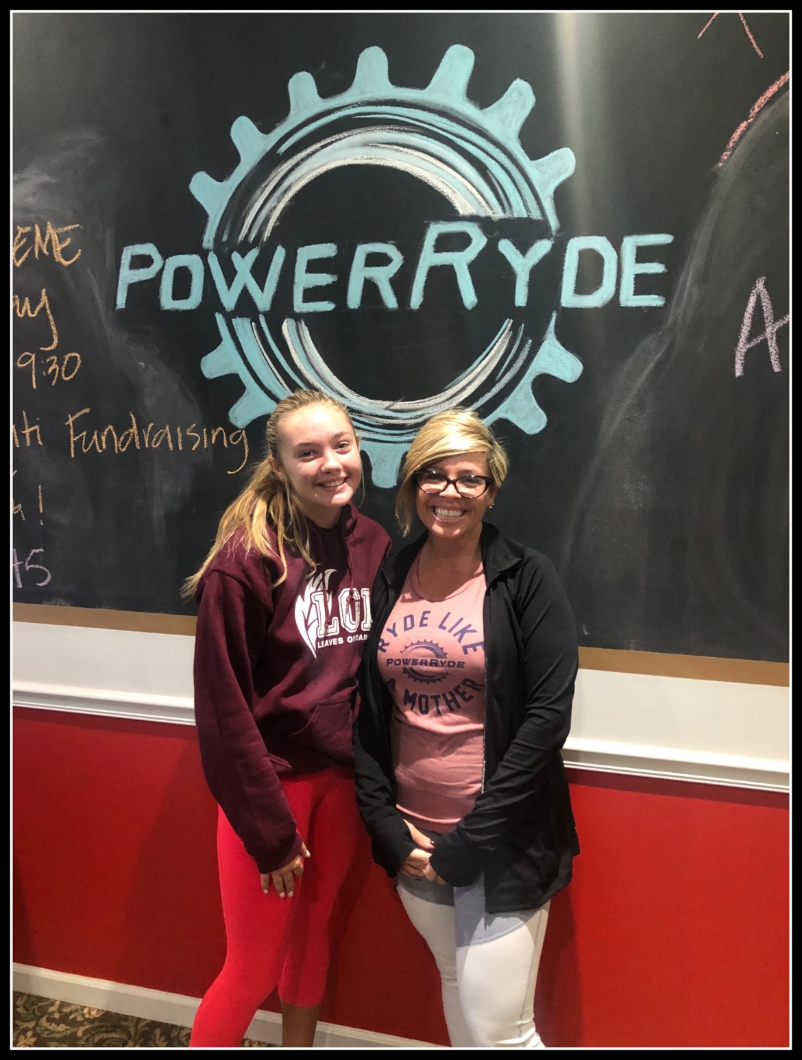 Melissa and Abbey Kappes in front of chalk PowerRyde logo